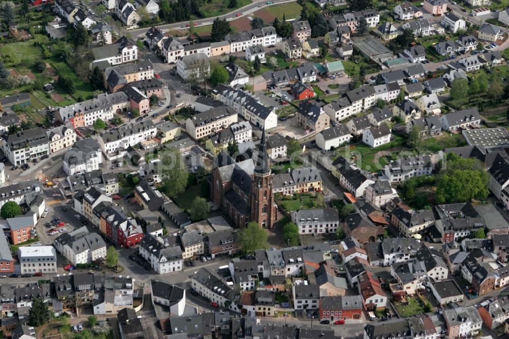 Trier from the bird's eye view: View of the district of Euren in Trier in the state of Rhineland-Palatinate. Euren is located amidst hills and forest on the left shore of the river Mosel. The catholic parochial church Saint Helena with its distinct red-brown colour and its tower is one of the landmarks of the district