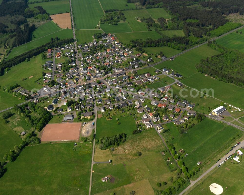 Aerial photograph Ailertchen - View of the borough of Ailertchen in the state of Rhineland-Palatinate. The borough is located in the county district and region of Westerwald. The residential village is surrounded by fields and meadows. It is located on federal highway B255