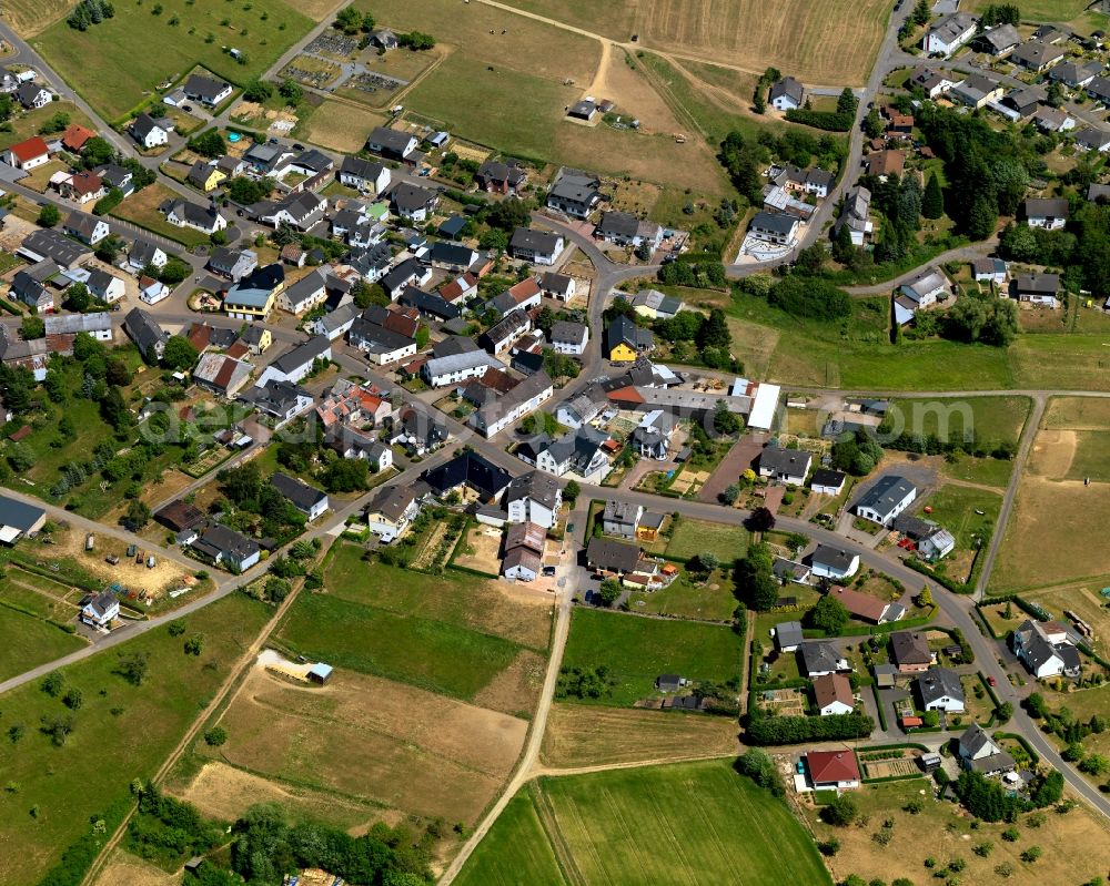 Aerial image Auderath - View of Auderath in the state of Rhineland-Palatinate. The borough and municipiality is located in the county district of Cochem-Zell in the Volcanic Eifel region. It is surrounded by agricultural land, meadows and forest. The hamlets Waldfrieden and Wilhelmshoehe belong to the village