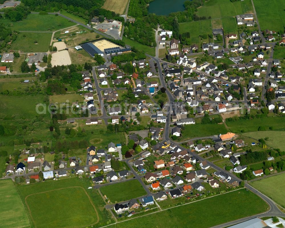 Bannberscheid from the bird's eye view: View of Bannberscheid in the state of Rhineland-Palatinate. The borough and municipiality is located in the county district of Westerwaldkreis in the low mountain range of Westerwald - the so called Kannenbaeckerland. Bannberscheid is surrounded by agricultural land and meadows