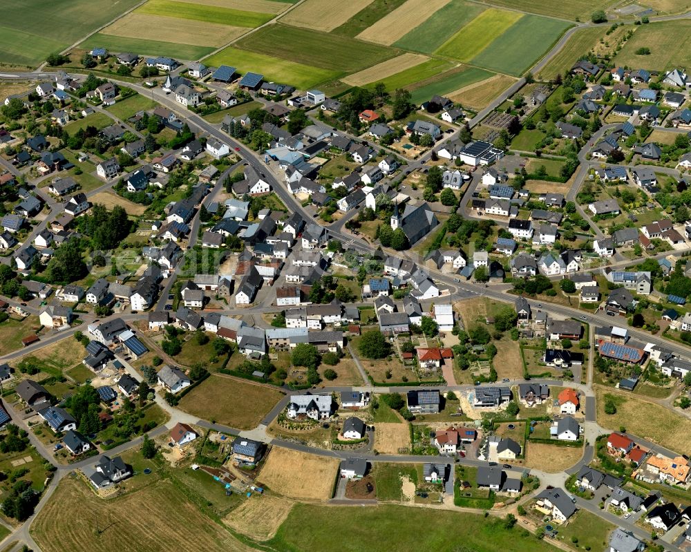 Aerial photograph Büchel - View of Buechel in the state of Rhineland-Palatinate. The borough and municipiality is located in the county district of Cochem-Zell. Buechel is home to a military airfield where nuclear weapons are stored. It is surrounded by agricultural land, meadows and forest