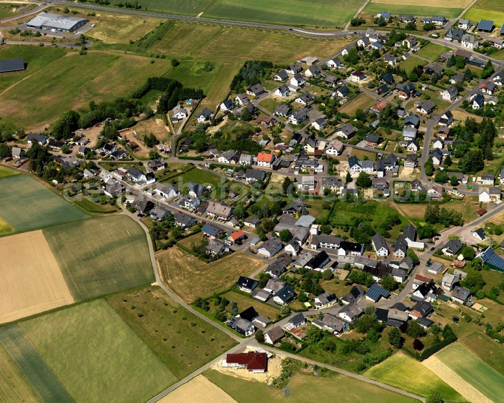 Büchel from above - View of Buechel in the state of Rhineland-Palatinate. The borough and municipiality is located in the county district of Cochem-Zell. Buechel is home to a military airfield where nuclear weapons are stored. It is surrounded by agricultural land, meadows and forest