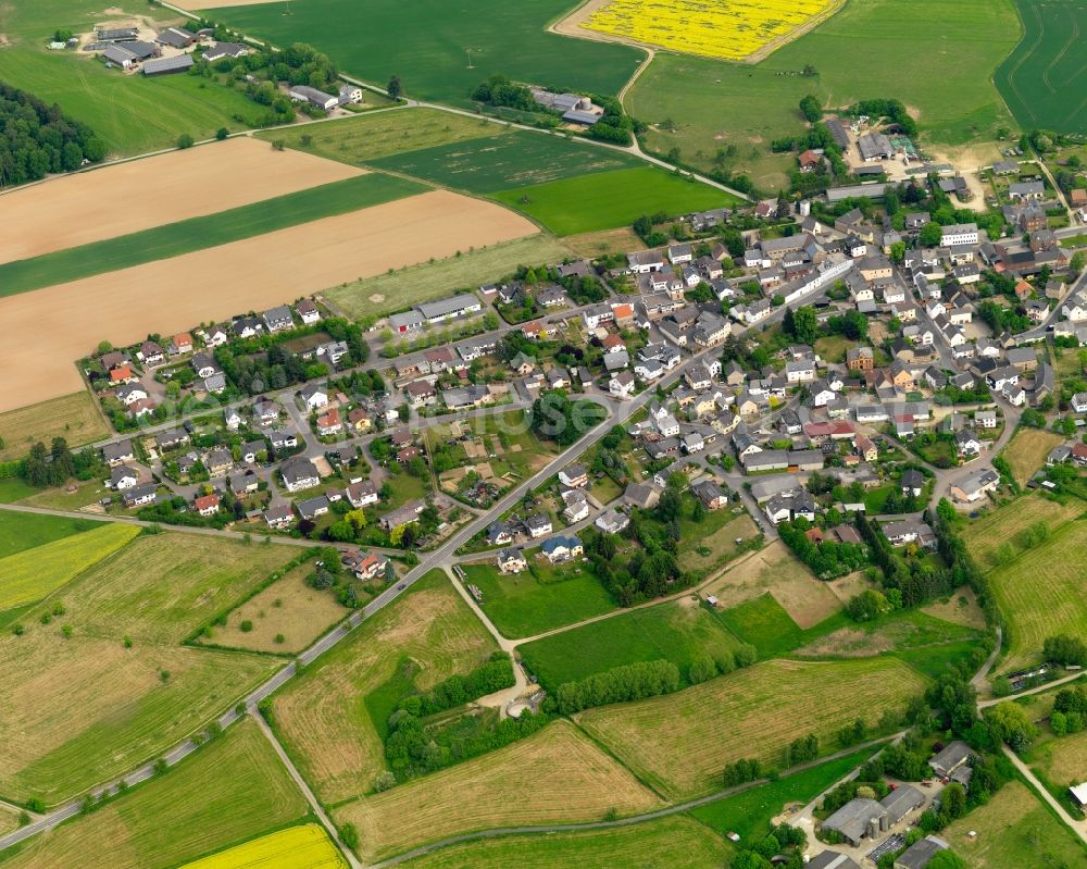 Aerial image Bogel - View of the borough of Bogel in the state of Rhineland-Palatinate. The borough and municipiality is located in the county district of Rhine-Lahn, in the Taunus mountain region. The agricultural village consists of residential areas and is surrounded by rapeseed fields and meadows. The official tourist resort is located on federal highway B274