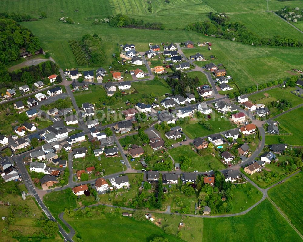 Aerial image Brandscheid - View of Brandscheid in the state of Rhineland-Palatinate. The borough and municipiality Brandscheid is located in the county district of Westerwaldkreis and is a rural residential borough. Brandscheid is surrounded by agricultural land, hills and meadows and located on a mountain slope of a large forest area