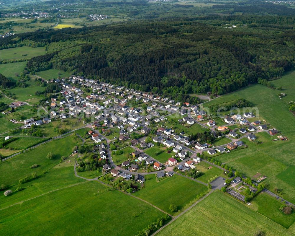 Aerial photograph Brandscheid - View of Brandscheid in the state of Rhineland-Palatinate. The borough and municipiality Brandscheid is located in the county district of Westerwaldkreis and is a rural residential borough. Brandscheid is surrounded by agricultural land, hills and meadows and located on a mountain slope of a large forest area