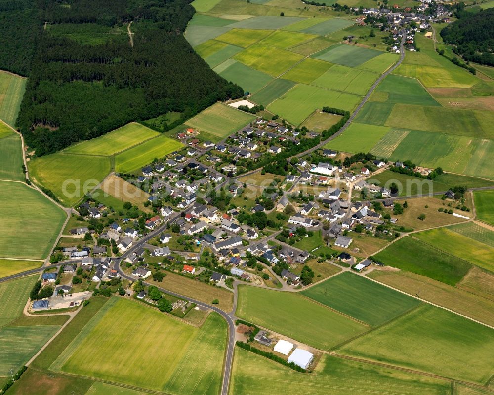 Breitenthal from the bird's eye view: View of Breitenthal in the state of Rhineland-Palatinate. The borough and municipiality is located in the county district of Birkenfeld, in a bend of the Hosenbach creek in the Hunsrueck region. It is surrounded by agricultural land, meadows and forest