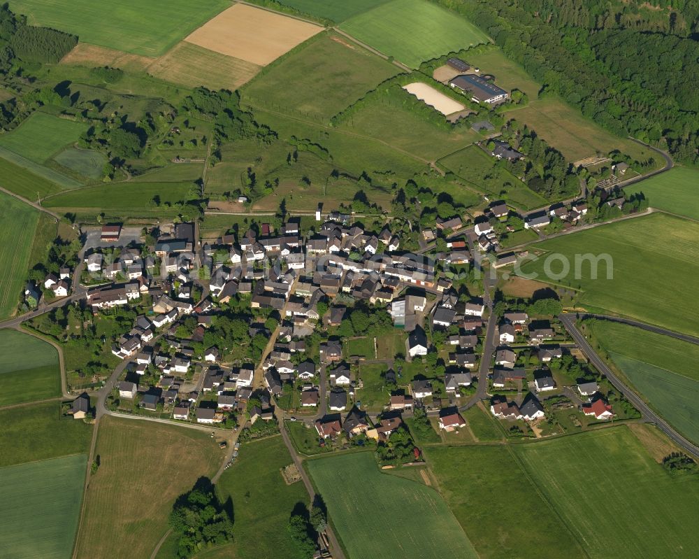 Aerial photograph Bremberg - View of the borough of Bremberg in the state of Rhineland-Palatinate. The borough and municipiality is located in the county district of Rhine-Lahn. The agricultural village consists of residential buildings and areas, sits in the Western Taunus mountain range and is surrounded by meadows and fields