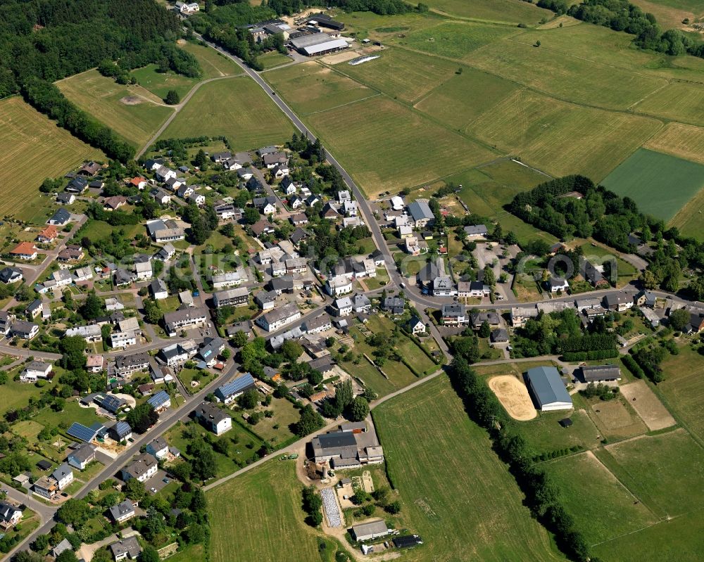 Bruchweiler from the bird's eye view: View of Bruchweiler in the state of Rhineland-Palatinate. The borough and municipiality is an official spa resort and located in the county district of Birkenfeld, in the Hunsrueck region. It is surrounded by agricultural land, meadows and forest. A clinic for youth and children rehab is located outside the core of the village