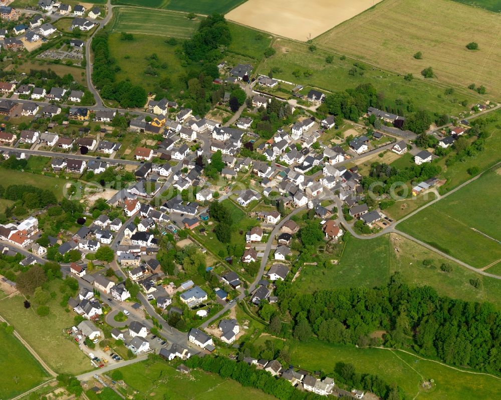 Buch from above - View of the borough of Buch in the state of Rhineland-Palatinate. The borough and municipiality is located in the county district of Rhine-Lahn, in the Western Hintertaunus mountain region. The agricultural village consists of residential areas and is surrounded by rapeseed fields and meadows