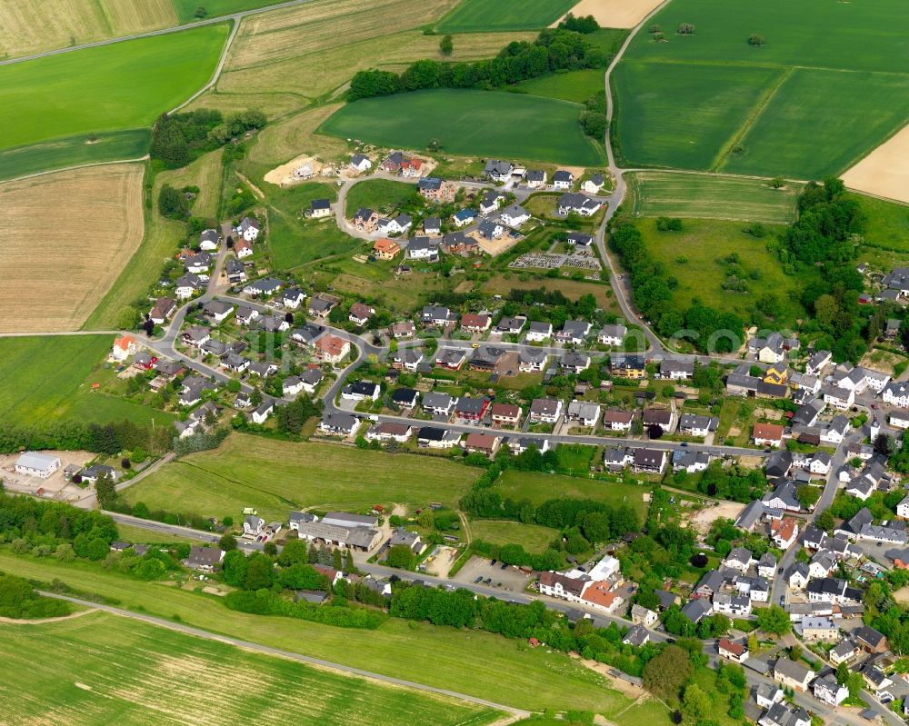 Aerial image Buch - View of the borough of Buch in the state of Rhineland-Palatinate. The borough and municipiality is located in the county district of Rhine-Lahn, in the Western Hintertaunus mountain region. The agricultural village consists of residential areas and is surrounded by rapeseed fields and meadows