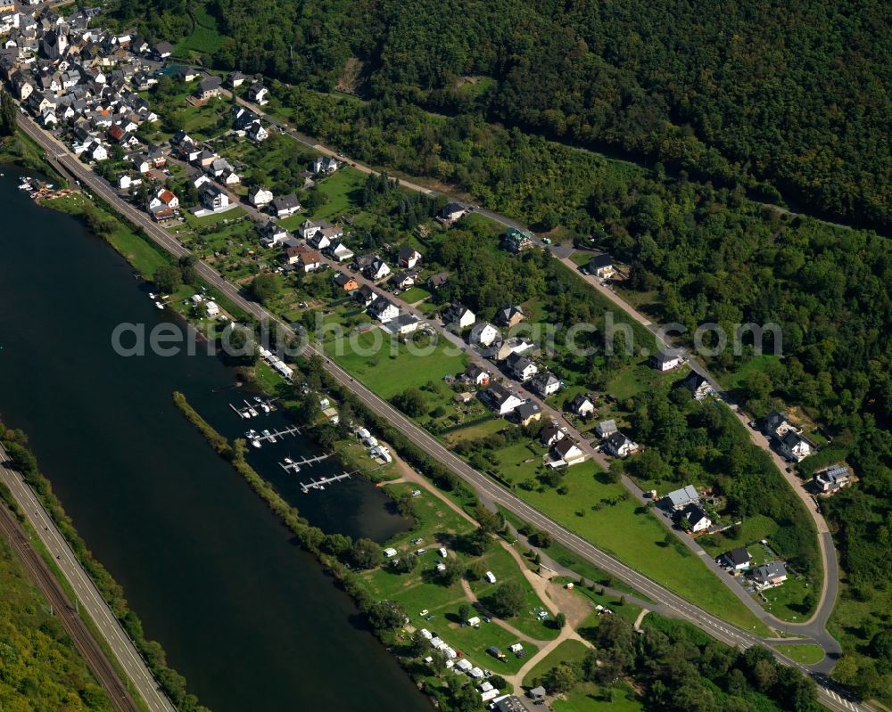 Burgen from above - View of the borough and municipiality Burgen on the river Moselle in the state of Rhineland-Palatinate. The Moselle is the biggest side river of the Rhine and is characterised by its deep valley in the area. The name Terrassenmosel - terrace moselle - stems from these environmental circumstances. Located in the valley and on its shores are small cities and villages, as well as vineyards and acres. Burgen is an official spa resort and is located on the mouth of Baybach creek