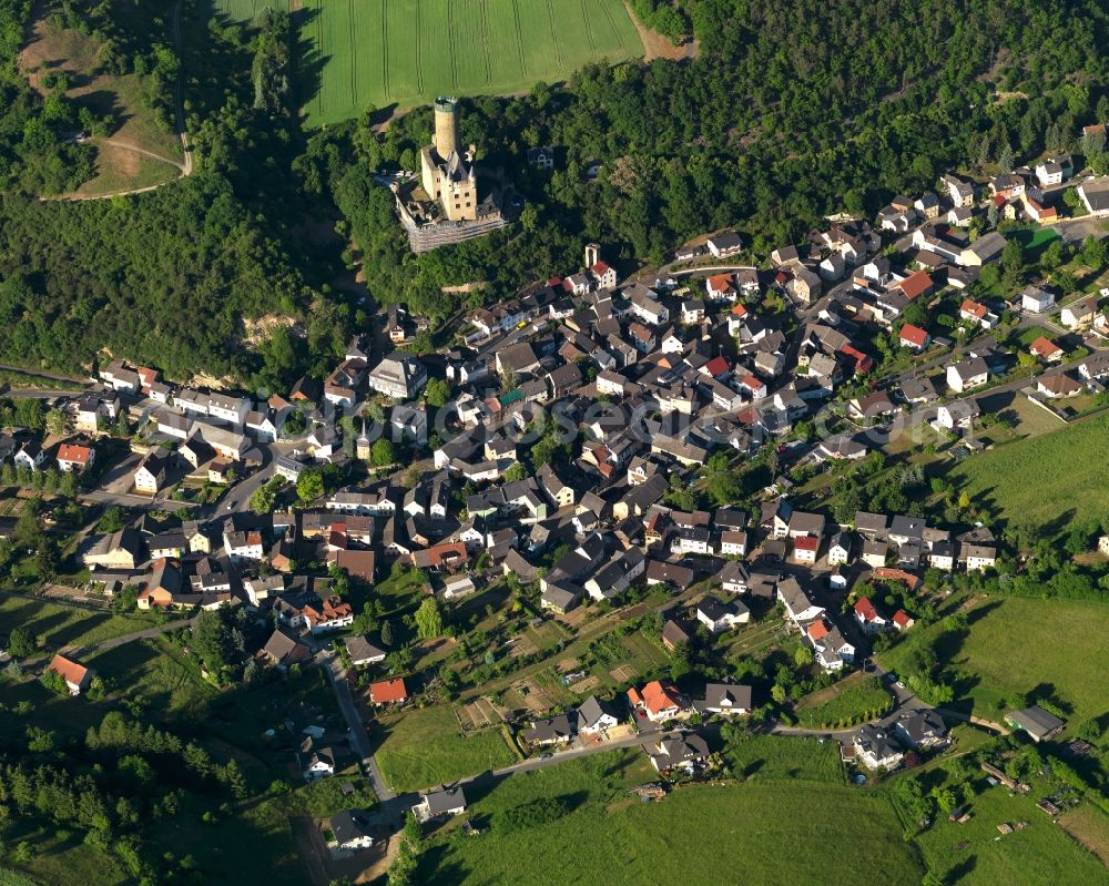 Burgschwalbach from the bird's eye view: View of the borough of Burgschwalbach in the state of Rhineland-Palatinate. The borough and municipiality is located in the county district of Rhine-Lahn. The agricultural village consists of residential buildings and areas, is an official tourist resort and is surrounded by meadows and fields. The castle of the same name is located on a hill above the village