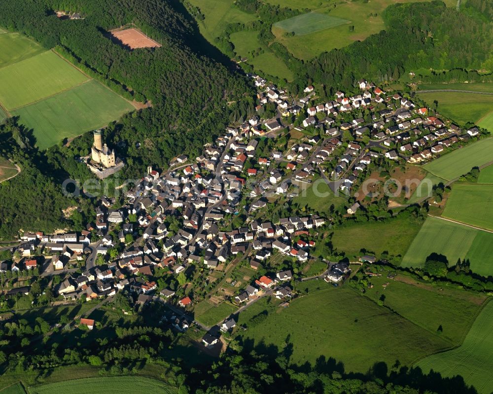 Aerial image Burgschwalbach - View of the borough of Burgschwalbach in the state of Rhineland-Palatinate. The borough and municipiality is located in the county district of Rhine-Lahn. The agricultural village consists of residential buildings and areas, is an official tourist resort and is surrounded by meadows and fields. The castle of the same name is located on a hill above the village