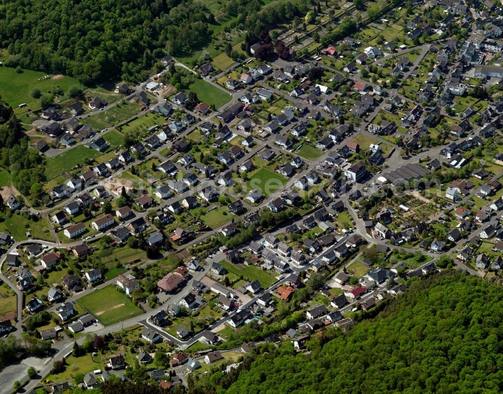 Daaden from the bird's eye view: View of Daaden in the state of Rhineland-Palatinate. The borough and municipiality Daaden is located in the county district of Altenkirchen in the Westerwald forest region and surrounded by fields, meadows and forest. The official tourist resort is located right on the border to the state of North Rhine-Westphalia. The river Daade takes its course through the village