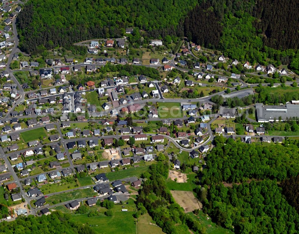 Aerial image Daaden - View of Daaden in the state of Rhineland-Palatinate. The borough and municipiality Daaden is located in the county district of Altenkirchen in the Westerwald forest region and surrounded by fields, meadows and forest. The official tourist resort is located right on the border to the state of North Rhine-Westphalia. The river Daade takes its course through the village