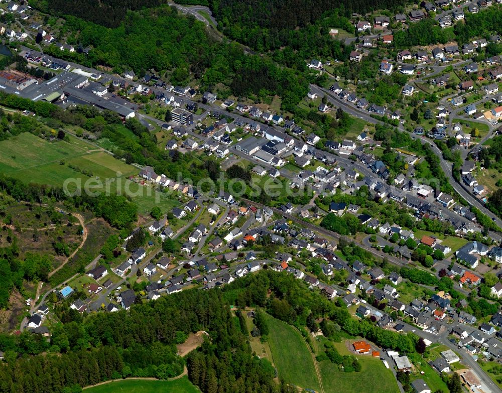 Daaden from above - View of Daaden in the state of Rhineland-Palatinate. The borough and municipiality Daaden is located in the county district of Altenkirchen in the Westerwald forest region and surrounded by fields, meadows and forest. The official tourist resort is located right on the border to the state of North Rhine-Westphalia. The river Daade takes its course through the village