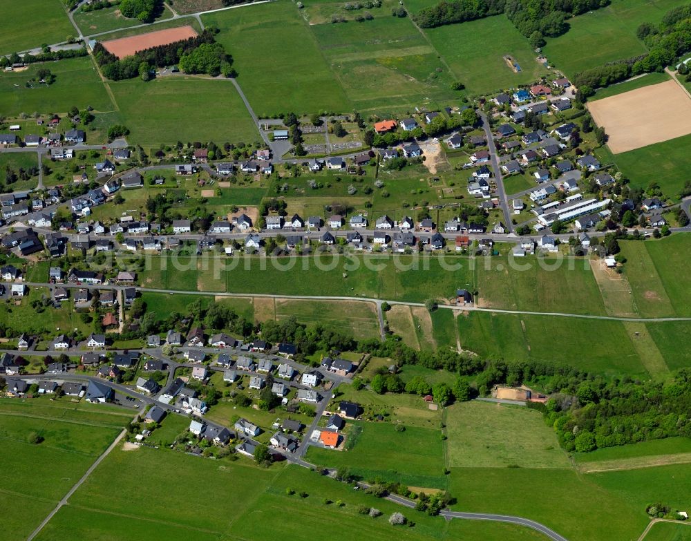 Derschen from above - View of Derschen in the state of Rhineland-Palatinate. The borough and municipiality Derschen is located in the county district of Altenkirchen in the Westerwald forest region and surrounded by fields, meadows and forest. The creek Derscher Bach takes its course through the agricultural village