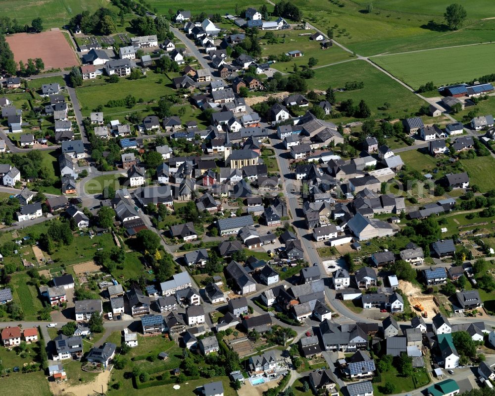 Dickenschied from the bird's eye view: View of Dickenschied in the state of Rhineland-Palatinate. Dickenschied is located in the county district of Rhine-Hunsrueck. The borough and municipiality consists of residential areas and agricultural land and sits on federal highway B421