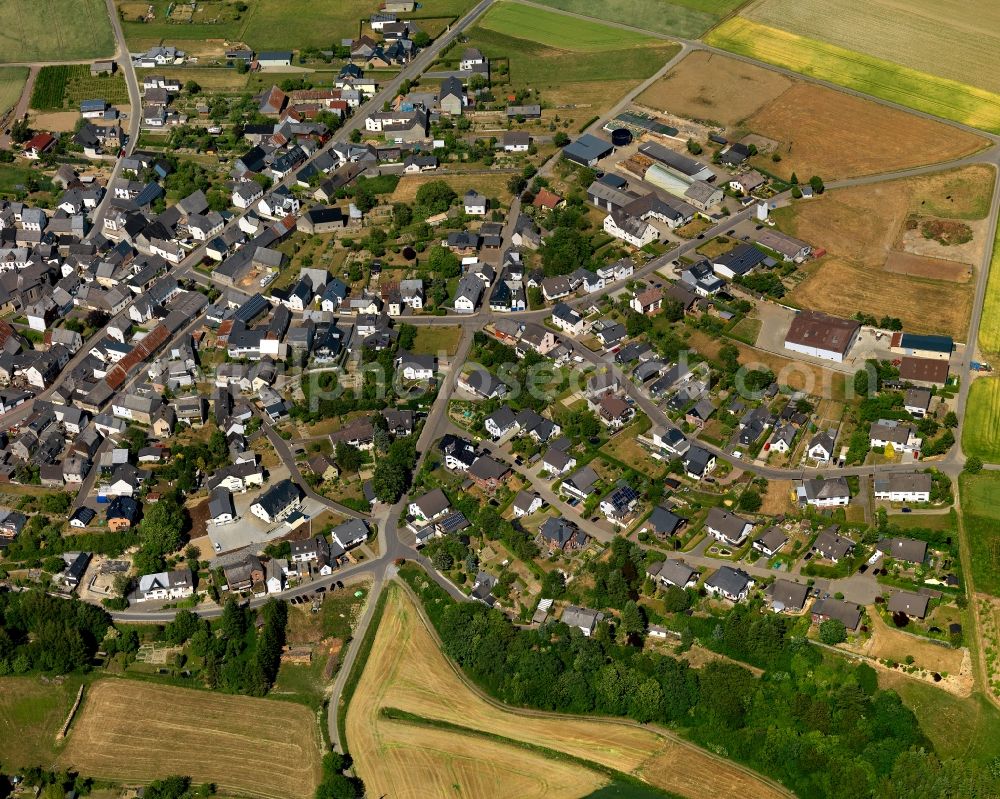 Düngenheim from the bird's eye view: View of Duengenheim in the state of Rhineland-Palatinate. The borough and municipiality is located in the county district of Cochem-Zell in the Eastern Eifel Region. Children's home St. Martin, Lehnholz and Weierthalerhof are hamlets of Duengenheim which is the largest municipiality in the association of municipialities of Kaiseresch. It is surrounded by agricultural land, meadows and forest