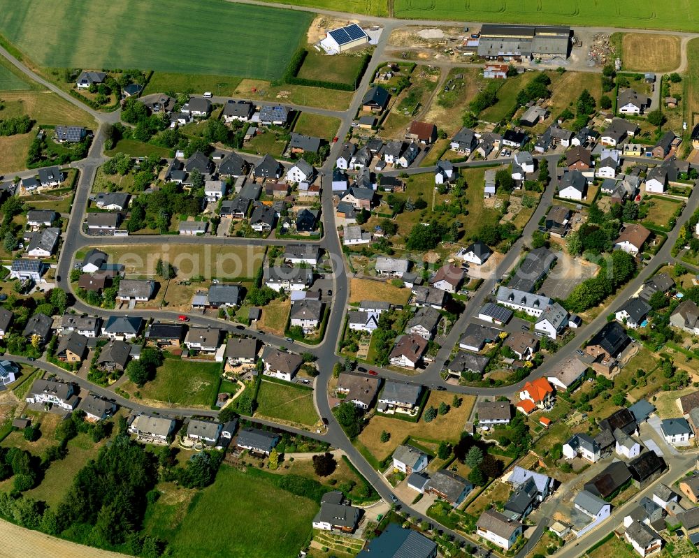 Düngenheim from the bird's eye view: View of Duengenheim in the state of Rhineland-Palatinate. The borough and municipiality is located in the county district of Cochem-Zell in the Eastern Eifel Region. Children's home St. Martin, Lehnholz and Weierthalerhof are hamlets of Duengenheim which is the largest municipiality in the association of municipialities of Kaiseresch. It is surrounded by agricultural land, meadows and forest