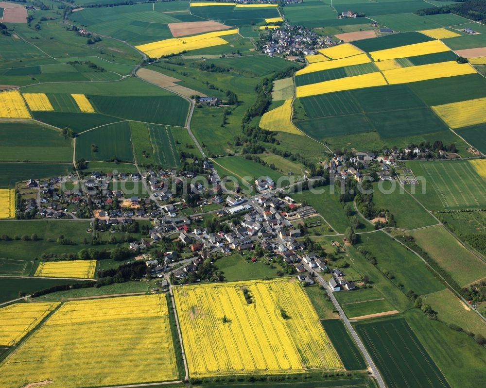 Dörsdorf from above - View of the borough of Doersdorf in the state of Rhineland-Palatinate. The borough and municipiality is located in the county district of Rhine-Lahn, in the Hintertaunus mountain region. The agricultural village consists of residential areas and is surrounded by rapeseed fields and meadows