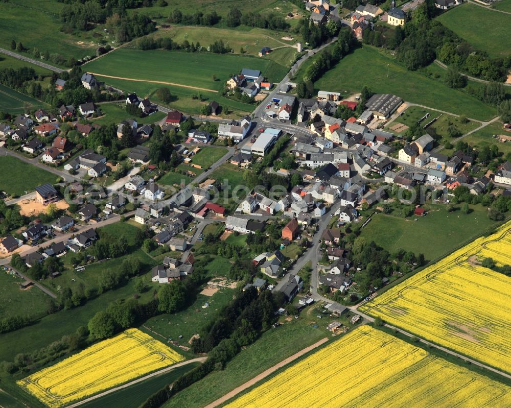 Dörsdorf from the bird's eye view: View of the borough of Doersdorf in the state of Rhineland-Palatinate. The borough and municipiality is located in the county district of Rhine-Lahn, in the Hintertaunus mountain region. The agricultural village consists of residential areas and is surrounded by rapeseed fields and meadows