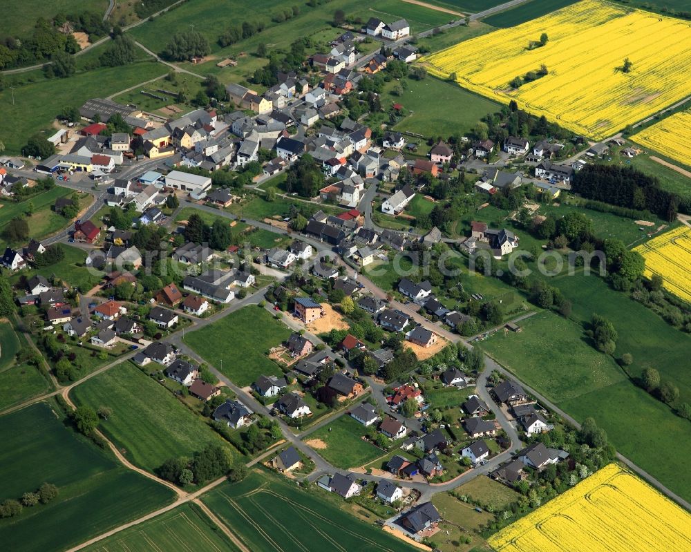 Aerial image Dörsdorf - View of the borough of Doersdorf in the state of Rhineland-Palatinate. The borough and municipiality is located in the county district of Rhine-Lahn, in the Hintertaunus mountain region. The agricultural village consists of residential areas and is surrounded by rapeseed fields and meadows
