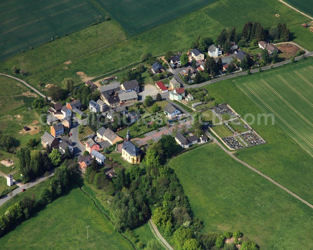 Aerial photograph Dörsdorf - View of the borough of Doersdorf in the state of Rhineland-Palatinate. The borough and municipiality is located in the county district of Rhine-Lahn, in the Hintertaunus mountain region. The agricultural village consists of residential areas and is surrounded by rapeseed fields and meadows