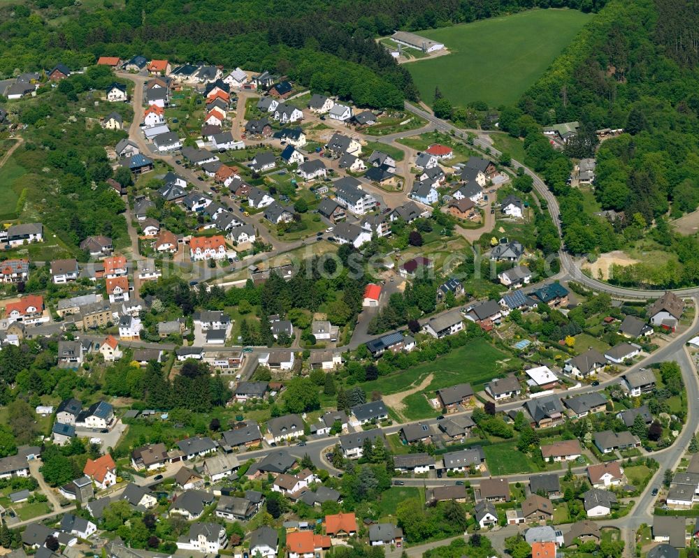 Ettringen from the bird's eye view: View of Ettringen in the state of Rhineland-Palatinate. The borough and municipiality is located in the county district of Mayen-Koblenz and surrounded by hills, forest and fields. It mainly consists of residential areas. Ettringen is know for its volcanic origin and mining facilities