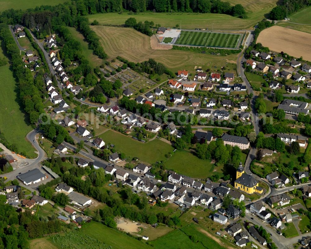 Friesenhagen from above - View of Friesenhagen in the state of Rhineland-Palatinate. Friesenhagen is an official tourist resort. It is surrounded by hills, fields and wooded areas