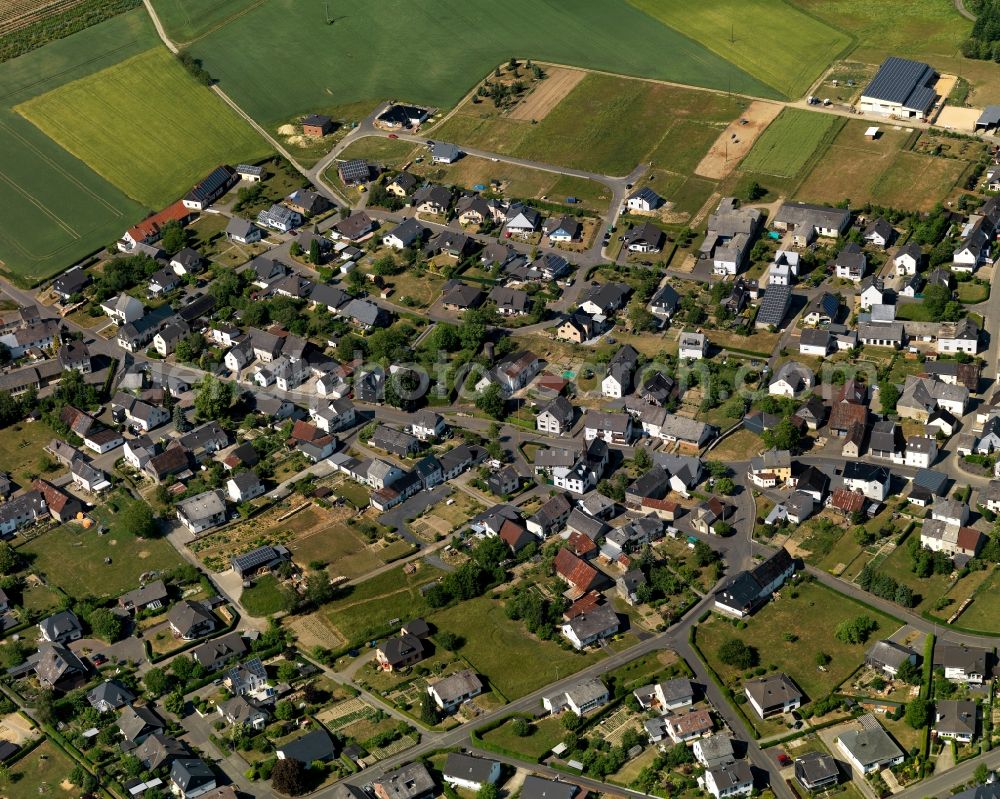 Aerial image Greimersburg - View of Greimersburg in the state of Rhineland-Palatinate. The borough and municipiality is located in the county district of Cochem-Zell in the East Eifel region. Greimersburg is surrounded by agricultural land and meadows and includes several small hamlets and settlements