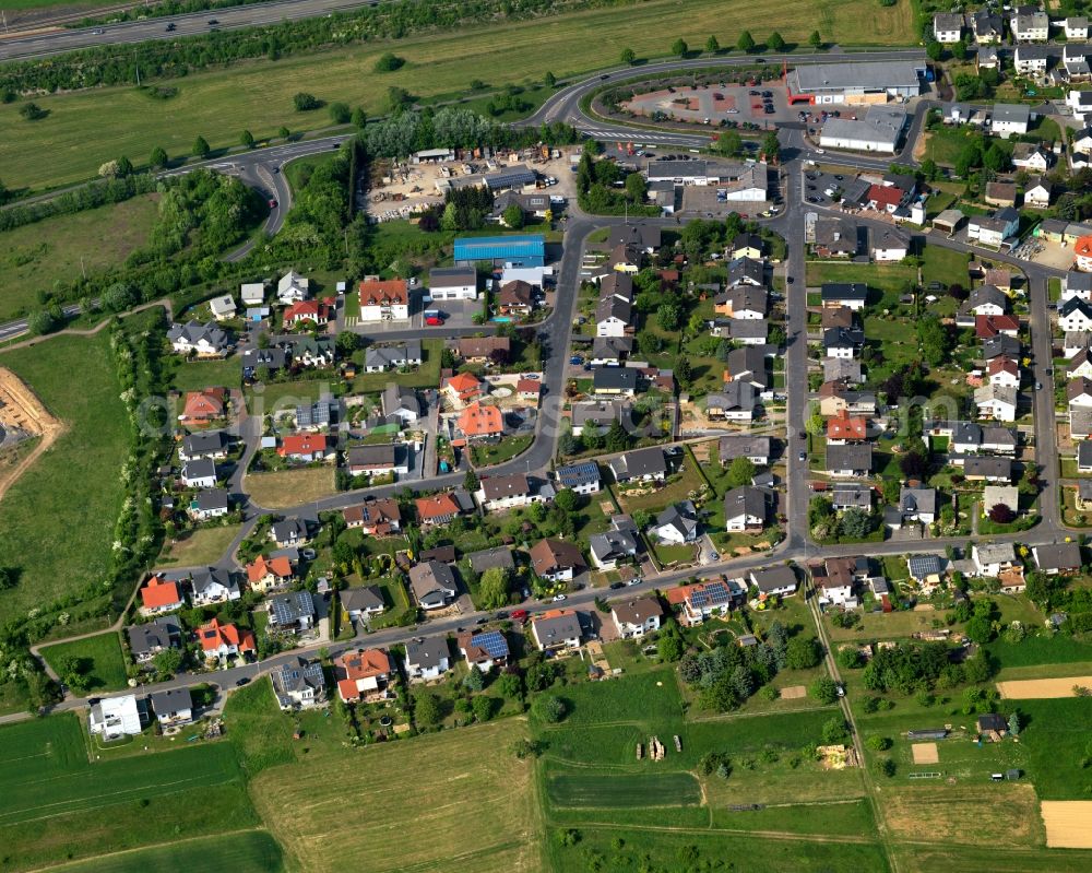 Aerial image Görgeshausen - View of Goergeshausen in the state of Rhineland-Palatinate. The borough and municipiality is located in the county district of Westerwaldkreis in the low mountain range of Westerwald in the South of the federal motorway A3. Goergeshausen is surrounded by agricultural land, forest and meadows