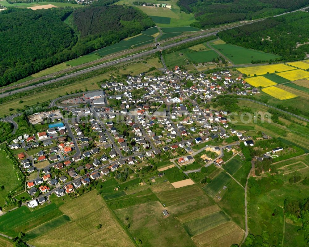 Aerial photograph Görgeshausen - View of Goergeshausen in the state of Rhineland-Palatinate. The borough and municipiality is located in the county district of Westerwaldkreis in the low mountain range of Westerwald in the South of the federal motorway A3. Goergeshausen is surrounded by agricultural land, forest and meadows