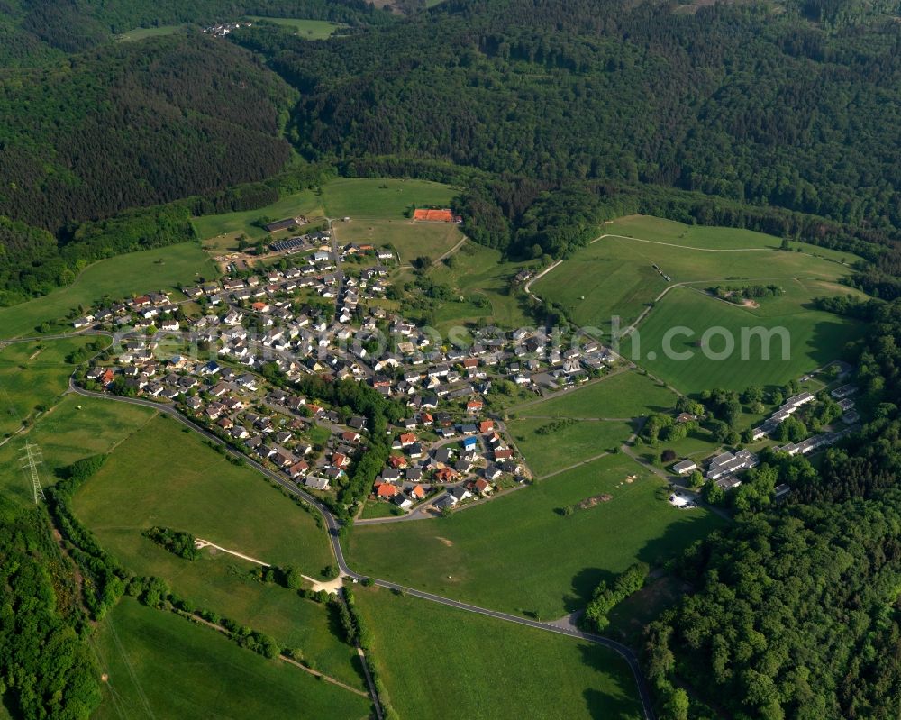 Hübingen from the bird's eye view: View of the borough of Huebingen in the state of Rhineland-Palatinate. The borough is located in the county district and region of Westerwald. The residential village is surrounded by fields and meadows. It sits in the Nature Park of Nassau