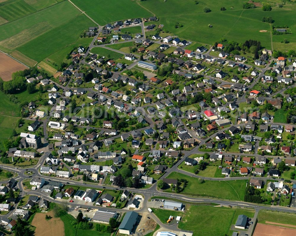 Hellenhahn-Schellenberg from above - View of the borough of Hellenhahn-Schellenberg in the state of Rhineland-Palatinate. The borough is located in the county district and region of Westerwald. The residential village is surrounded by fields and meadows. It sits right on federal highway B255