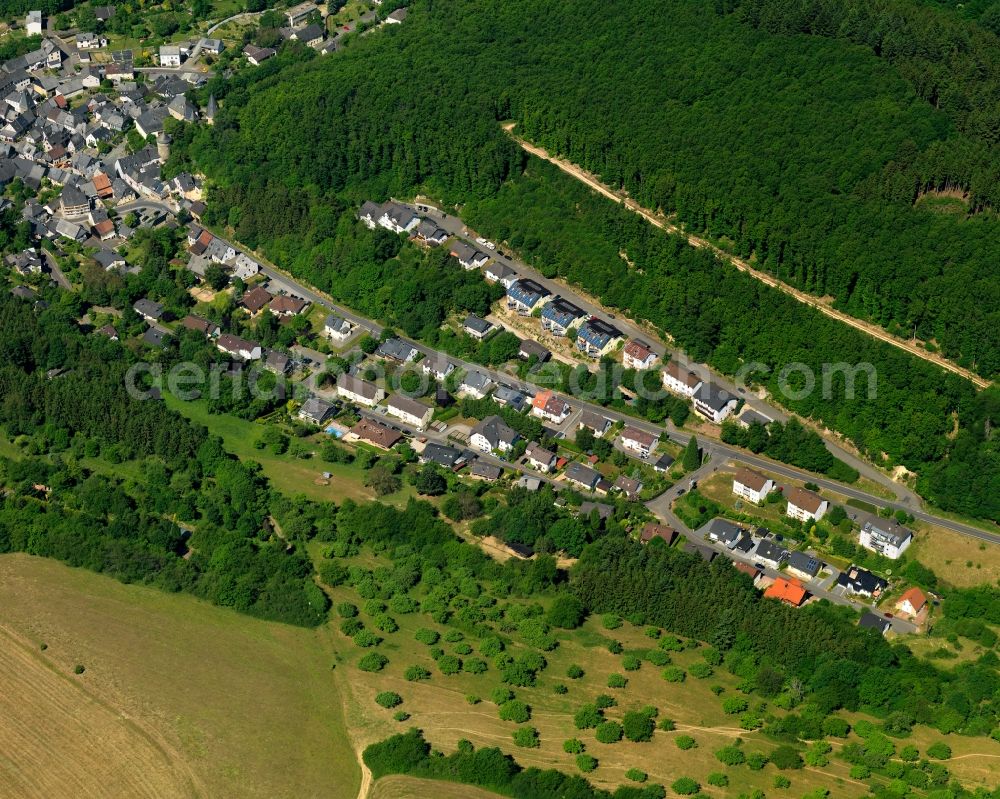 Herrstein from the bird's eye view: View of Herrstein in the state of Rhineland-Palatinate. The borough and municipiality is an official spa resort and located in the county district of Birkenfeld, in the Hunsrueck region at Idar Forest. It is surrounded by agricultural land, meadows and forest and located on Fischbach creek. It is known for the historic town centre and castle Herrstein