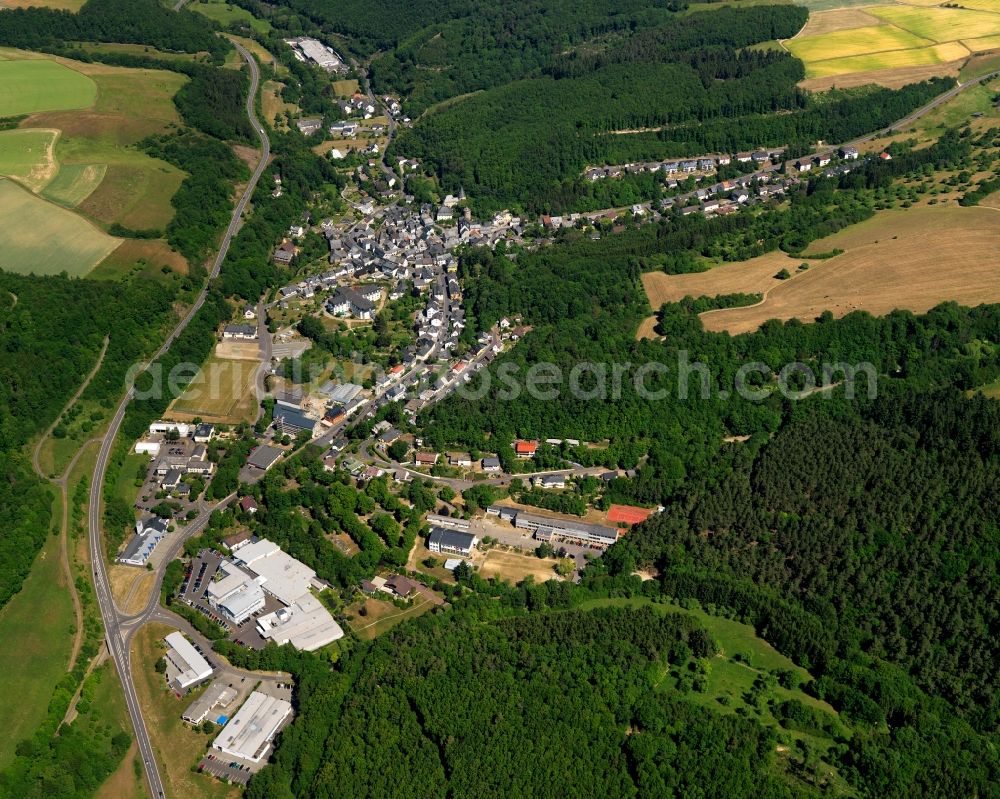 Aerial image Herrstein - View of Herrstein in the state of Rhineland-Palatinate. The borough and municipiality is an official spa resort and located in the county district of Birkenfeld, in the Hunsrueck region at Idar Forest. It is surrounded by agricultural land, meadows and forest and located on Fischbach creek. It is known for the historic town centre and castle Herrstein