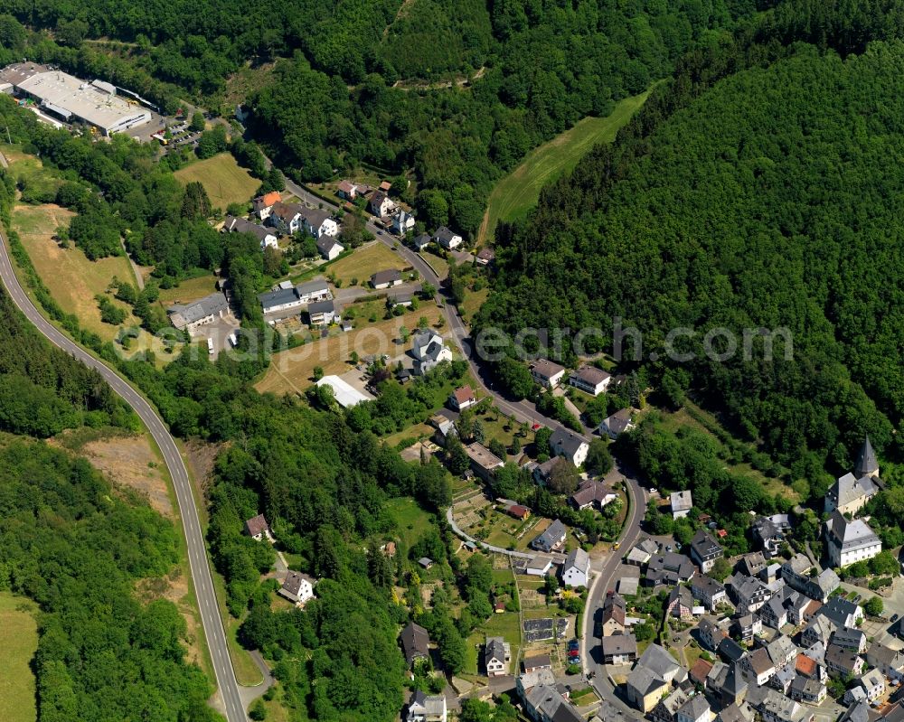 Aerial photograph Herrstein - View of Herrstein in the state of Rhineland-Palatinate. The borough and municipiality is an official spa resort and located in the county district of Birkenfeld, in the Hunsrueck region at Idar Forest. It is surrounded by agricultural land, meadows and forest and located on Fischbach creek. It is known for the historic town centre and castle Herrstein