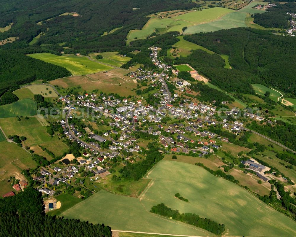 Hettenrodt from above - View of Hettenrodt in the state of Rhineland-Palatinate. The borough and municipiality is located in the county district of Birkenfeld, on a hill in the Nature Park Saar-Hunsrueck. It is surrounded by agricultural land, meadows and forest and consists of several hamlets and residential areas