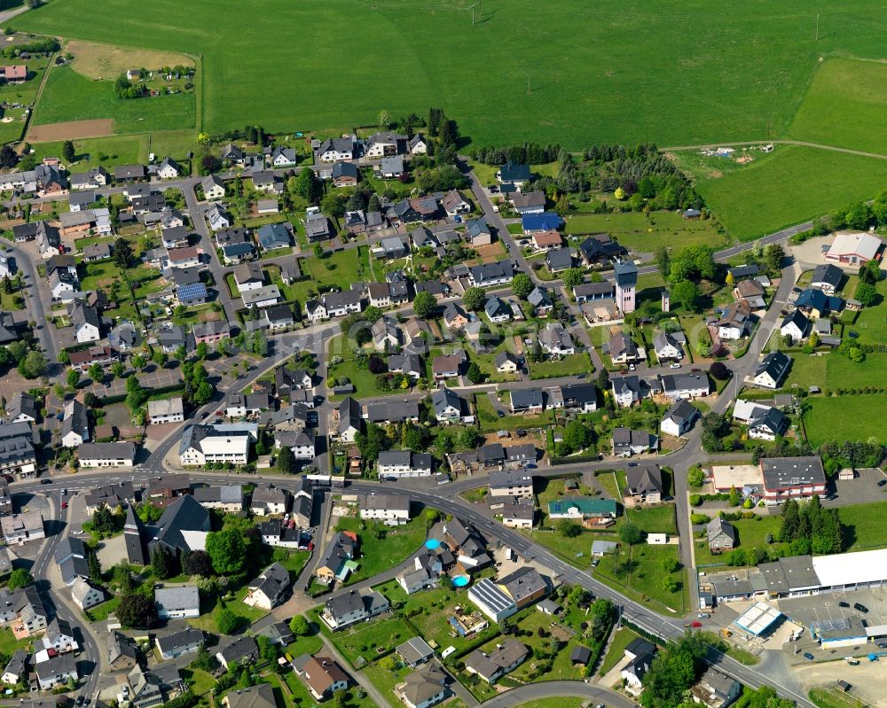 Höhn from the bird's eye view: View of the borough of Hoehn in the state of Rhineland-Palatinate. The borough is located in the county district and region of Westerwald. The residential village is surrounded by fields and meadows. It sits right on federal highway B255 and consists of several parts