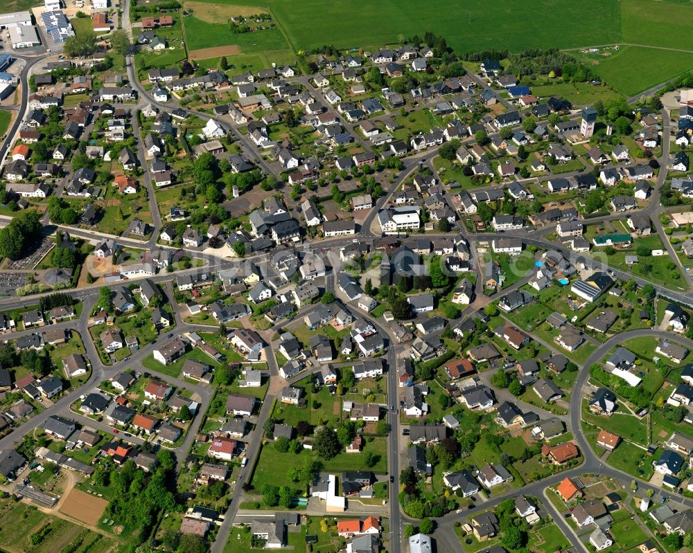 Aerial image Höhn - View of the borough of Hoehn in the state of Rhineland-Palatinate. The borough is located in the county district and region of Westerwald. The residential village is surrounded by fields and meadows. It sits right on federal highway B255 and consists of several parts