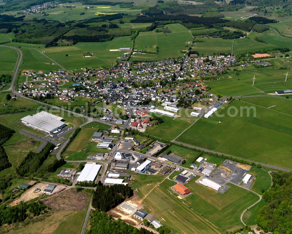 Hof from the bird's eye view: View of the borough of Hof (Westerwald) in the state of Rhineland-Palatinate. The borough is located in the county district and region of Westerwald. The residential village is surrounded by fields and meadows. An industrial area is located in the South on federal highway B414