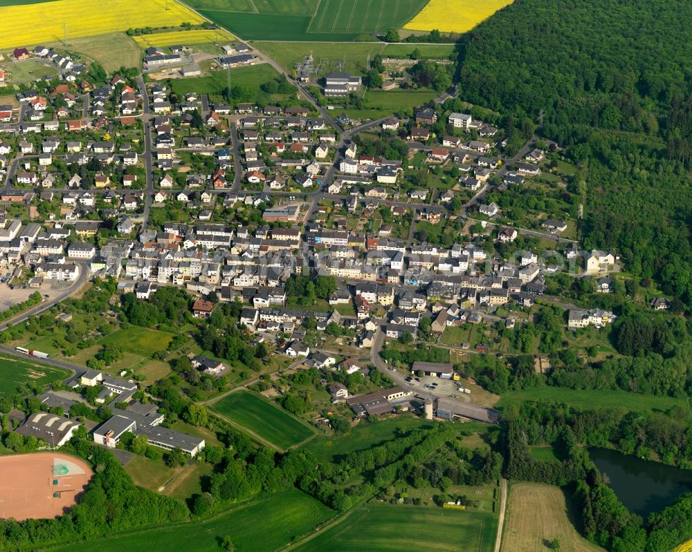 Aerial photograph Holzappel - View of the borough of Holzappel in the state of Rhineland-Palatinate. The borough is located in the county district of Rhein-Lahn-Kreis. The residential village is surrounded by rapeseed fields and meadows. It sits in the Nature Park of Nassau and is an official tourist resort