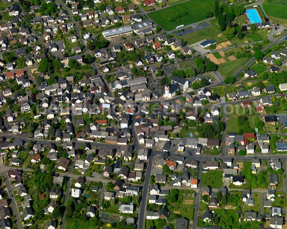 Hundsangen from the bird's eye view: View of Hundsangen in the state of Rhineland-Palatinate. The borough and municipiality is located in the county district of Westerwaldkreis on the border to the state of Hesse. Hundsangen is surrounded by agricultural land and meadows and is located on the federal road B8