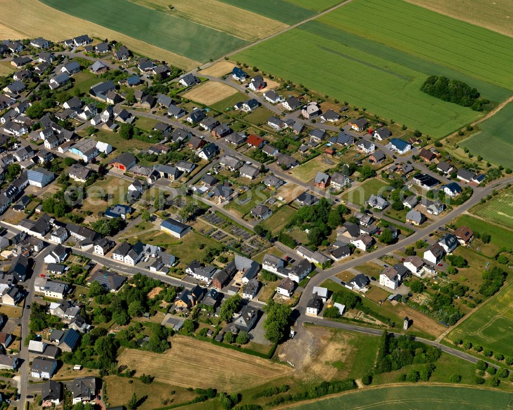 Illerich from above - View of Illerich in the state of Rhineland-Palatinate. The borough and municipiality is located in the county district of Cochem-Zell on the edge of the Eifel Region. Illerich is surrounded by agricultural land and meadows and includes the hamlets of Michelshof, Rosenhof and Waldhof