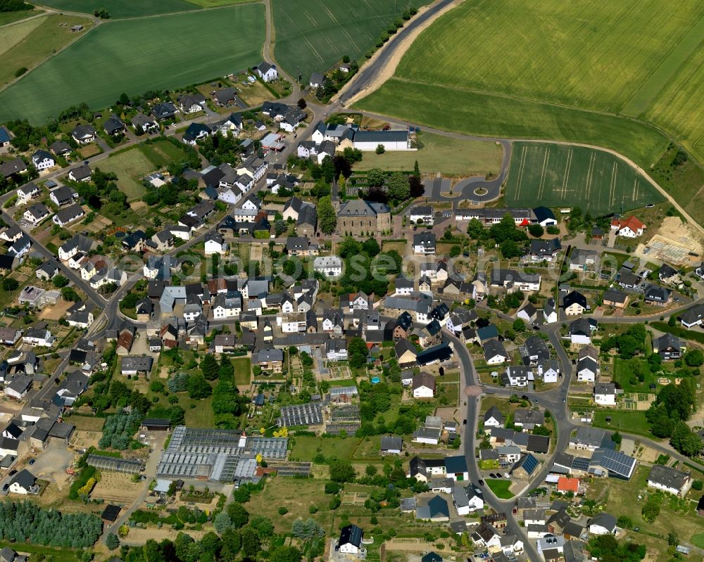 Kaifenheim from the bird's eye view: View of Kaifenheim in the state of Rhineland-Palatinate. The borough and municipiality is located in the county district of Cochem-Zell on the edge of the Eifel Region. Kaifenheim is surrounded by agricultural land, meadows and forest and is located the Brohlbach creek as well as in the Elz valley and close to the federal motorway A48