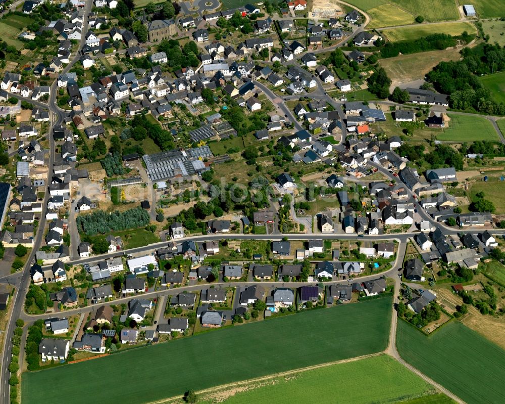 Aerial image Kaifenheim - View of Kaifenheim in the state of Rhineland-Palatinate. The borough and municipiality is located in the county district of Cochem-Zell on the edge of the Eifel Region. Kaifenheim is surrounded by agricultural land, meadows and forest and is located the Brohlbach creek as well as in the Elz valley and close to the federal motorway A48