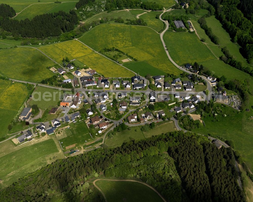 Aerial image Kaltenborn - View of the borough of Kaltenborn in the state of Rhineland-Palatinate. Kaltenborn is located in the centre of the Hocheifel region in the foothills of the Hohe Acht, the highest mountain range of the region. View of the centre of the borough with residential areas, agricultural land and farms, surrounded by forest and hills