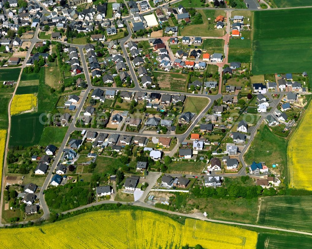 Kehrig from the bird's eye view: View of Kehrig in the state of Rhineland-Palatinate. The borough and municipiality is located in the county district of Mayen-Koblenz and surrounded by rapeseed fields and meadows. It mainly consists of residential areas. Kehrig is located in the Eifel region and includes several hamlets apart from the central village