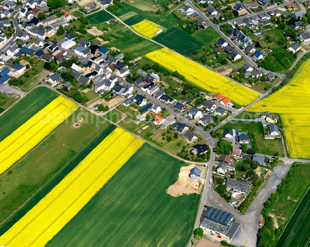 Aerial image Kehrig - View of Kehrig in the state of Rhineland-Palatinate. The borough and municipiality is located in the county district of Mayen-Koblenz and surrounded by rapeseed fields and meadows. It mainly consists of residential areas. Kehrig is located in the Eifel region and includes several hamlets apart from the central village